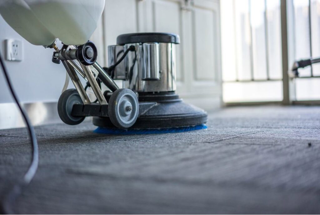 A professional carpet cleaning machine in action on a carpeted floor by Eco Clean Carpet and Tile Care in Rocklin, CA