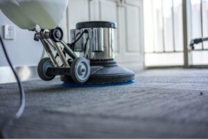 A professional carpet cleaning machine in action on a carpeted floor by Eco Clean Carpet and Tile Care in Rocklin, CA