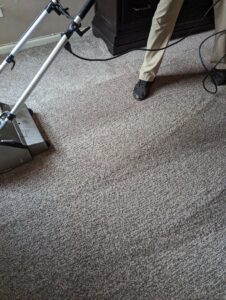 A professional carpet cleaning machine in use, creating clean lines on a carpet by R&W Carpet Cleaning & Water Extraction in Independence, MO.
