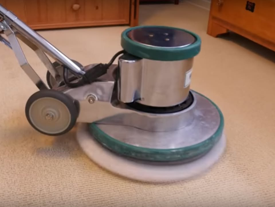 A professional carpet cleaning machine actively in use on a carpet by Richmond Kwik Dry in Midlothian, VA.