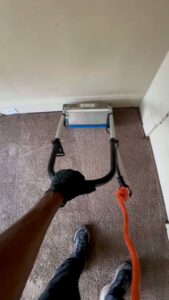 A professional from LHB Clean Team operating a carpet cleaning machine during a job in Harrisburg, PA.