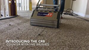 A professional using a carpet cleaning machine on a residential carpet at Presto Carpet And Tile Cleaning in Brentwood, CA.