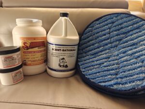 Various carpet cleaning products and a blue cleaning pad from Encapstore.com in Las Vegas, NV
