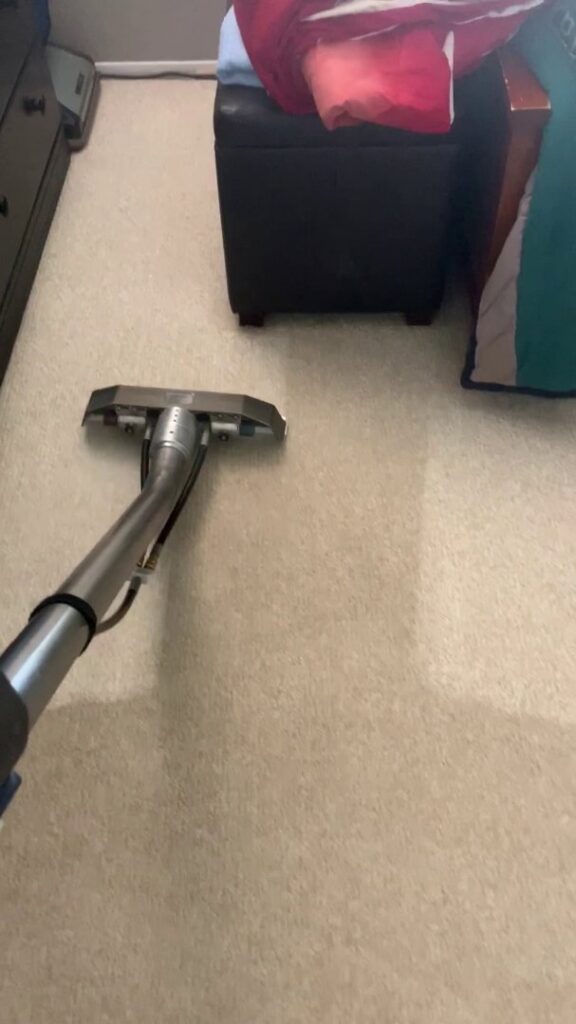A carpet cleaning wand in action, effectively cleaning a light-colored carpet by Soft N Dry, a contractor in Tucson, AZ.