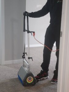 An LHB Clean Team professional performing a carpet cleaning service in a home in Harrisburg, PA.