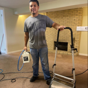 A professional performing carpet cleaning service with specialized equipment at Master Green Cleaning in Overland Park, KS.