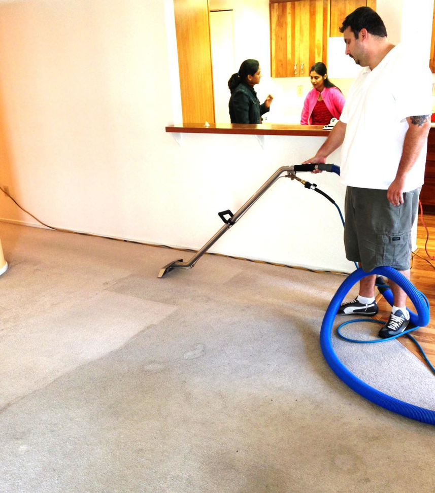 A professional performing carpet cleaning service at a home by Mexsteam in San Diego, CA