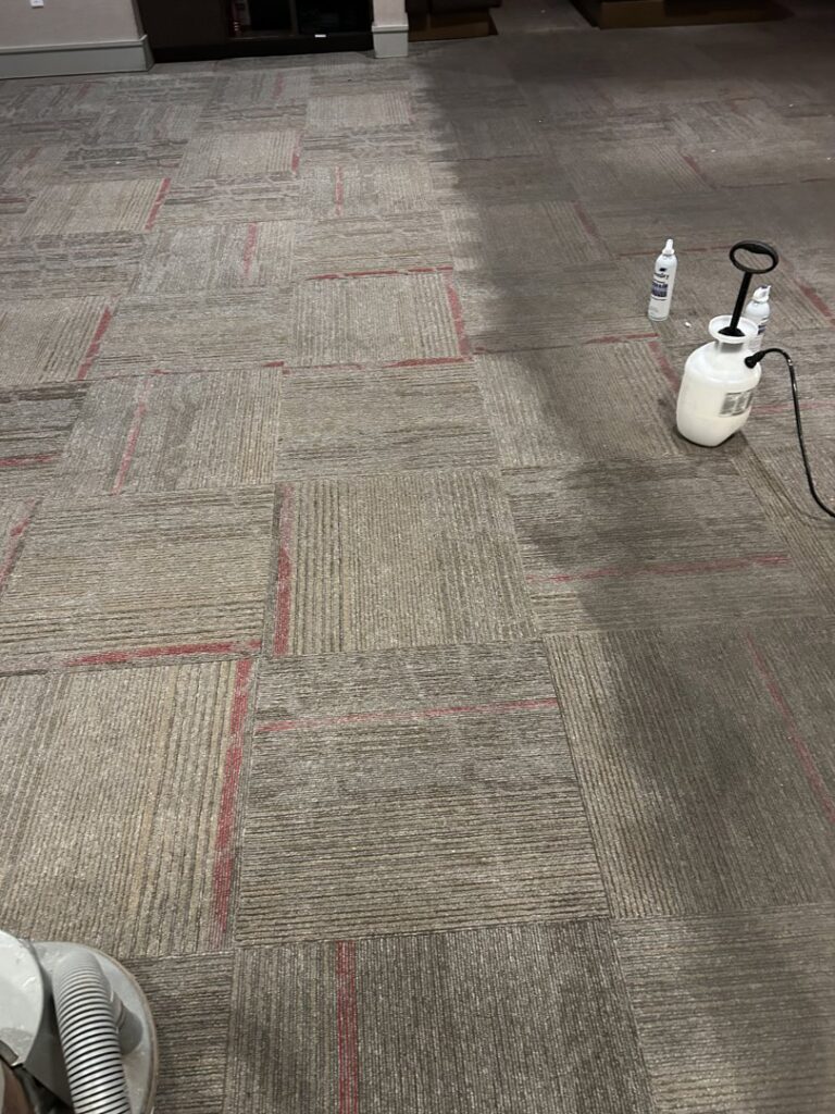 Cleaning solutions being applied to a commercial carpet during a cleaning service by Chem-Dry of Sioux Falls in Sioux Falls, SD.