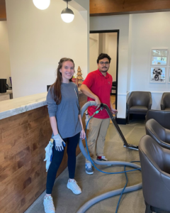 Evolution Carpet Cleaning team members with professional carpet cleaning equipment in Fresno, CA