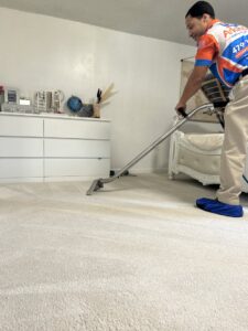 A carpet cleaning technician from Arkansas Floor and Upholstery Care LLC cleaning an installed carpet in Fort Smith, AR.