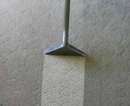 A carpet cleaning tool showing a clear before and after cleaning line on a light carpet by Hillsboro Carpet Cleaning in Hillsboro, OR.