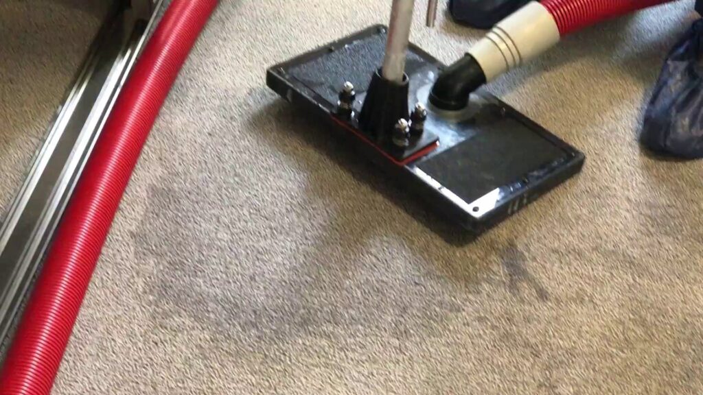 Carpet cleaning tool and hose on a carpet with visible clean lines by Allen Rapid Dry Carpet Cleaning in Anchorage, AK.