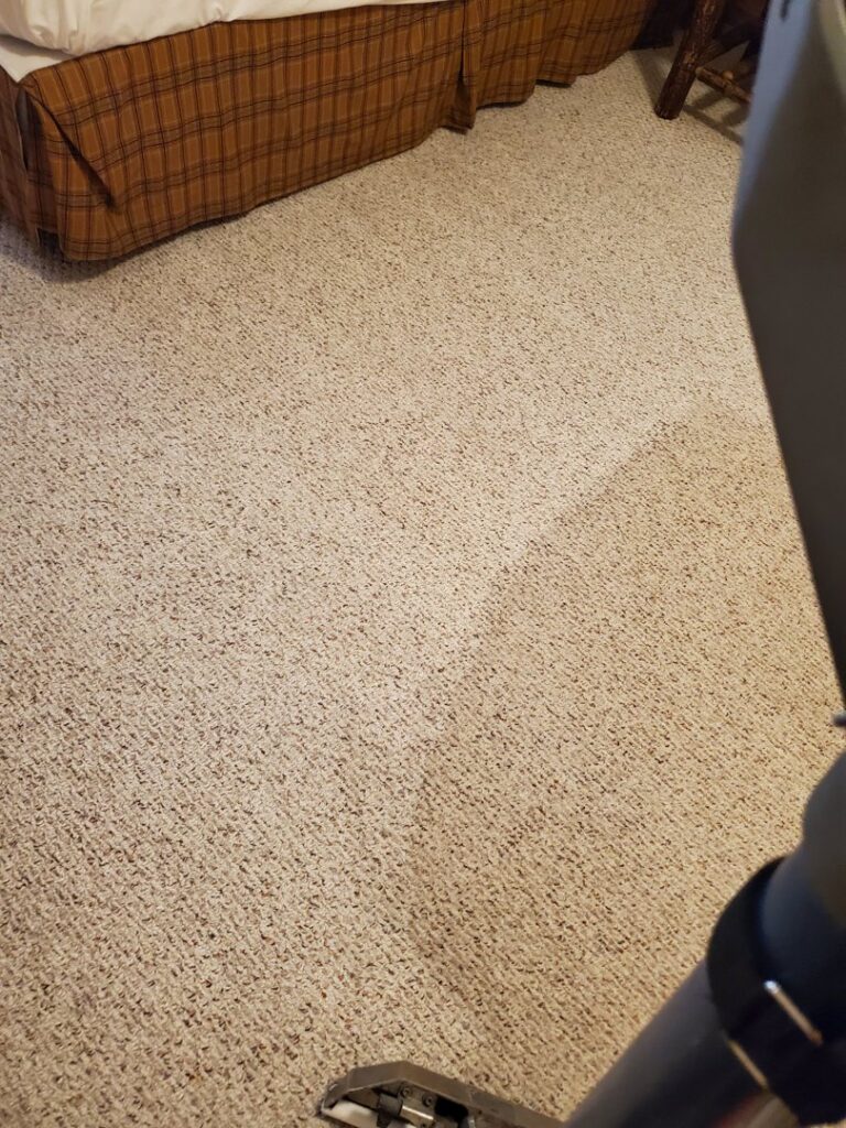 A carpet cleaning tool in action, showing a light-colored carpet being cleaned by Super Clean Carpet Cleaning in Idaho Falls, ID.