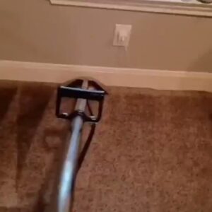 A professional carpet cleaning tool in action, cleaning a brown carpet by Superior Carpet Cleaning And Flooring in Dallas, TX