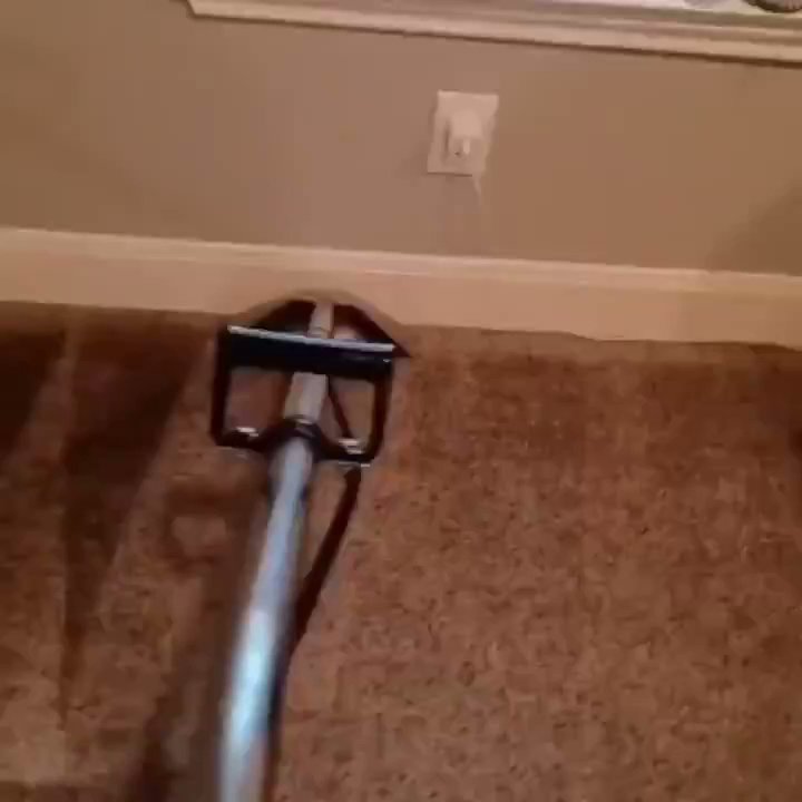A professional carpet cleaning tool in action, cleaning a brown carpet by Superior Carpet Cleaning And Flooring in Dallas, TX