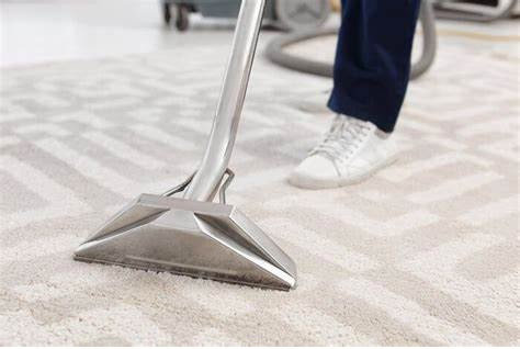 A carpet cleaning tool in use on a light patterned carpet by Premier Carpet Cleaning in Colorado Springs, CO.