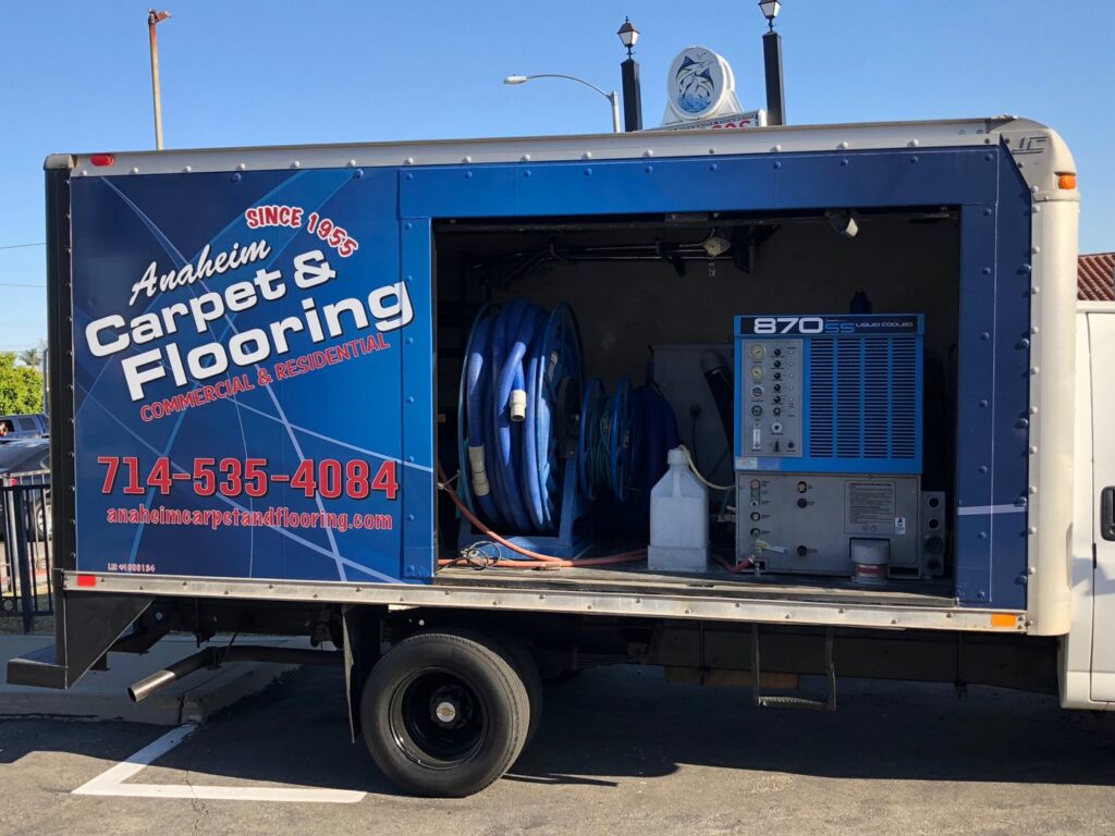 A branded carpet cleaning truck with visible equipment, representing Anaheim Carpet and Flooring services in Anaheim, CA.
