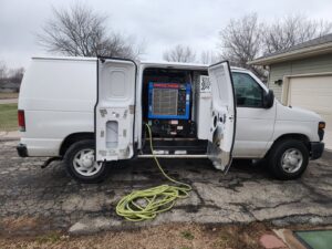 A carpet cleaning truck-mount system inside a service van for Andy's Cleaning Company LLC in Topeka, KS.