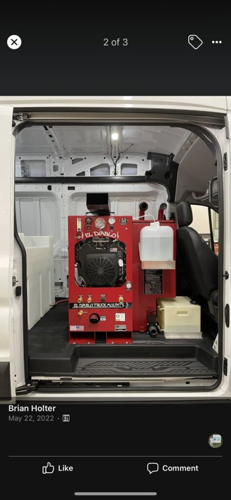 A red carpet cleaning truck mount machine installed inside a white service van for Steam Giant in Raleigh, NC.