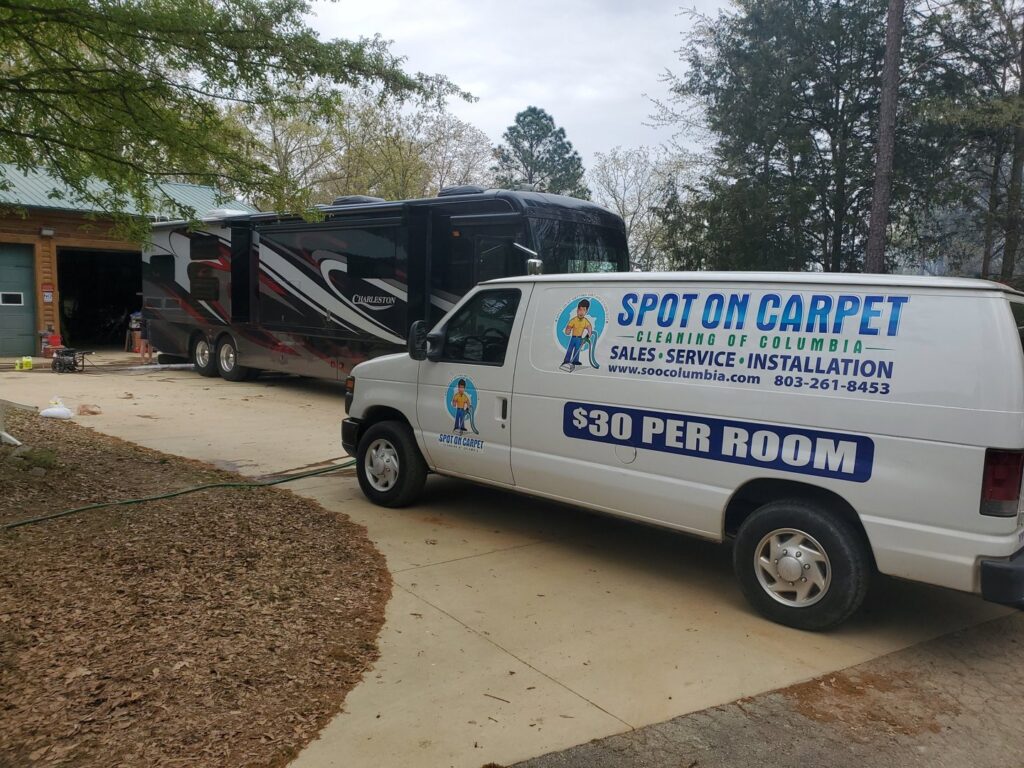 The Spot On Carpet Cleaning of Columbia, SC van parked at a residential job site, ready for service.