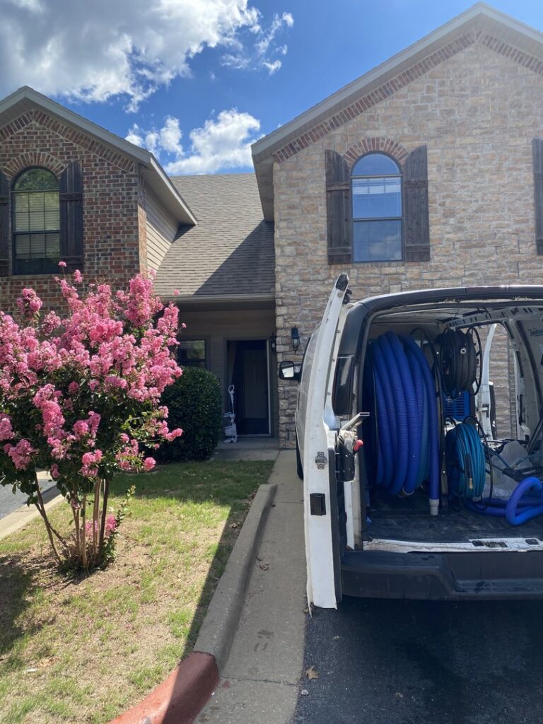 A work van loaded with professional carpet cleaning equipment, ready for service by The Floor Care Guys in Bentonville, AR.