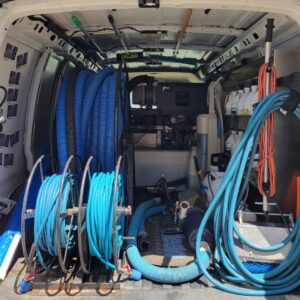 Interior of a True Organic Carpet Cleaning van showing hoses and professional equipment in Charlotte, NC.
