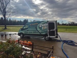 Customer First Carpet Cleaning van parked with cleaning hoses extended for a job in Appleton, WI