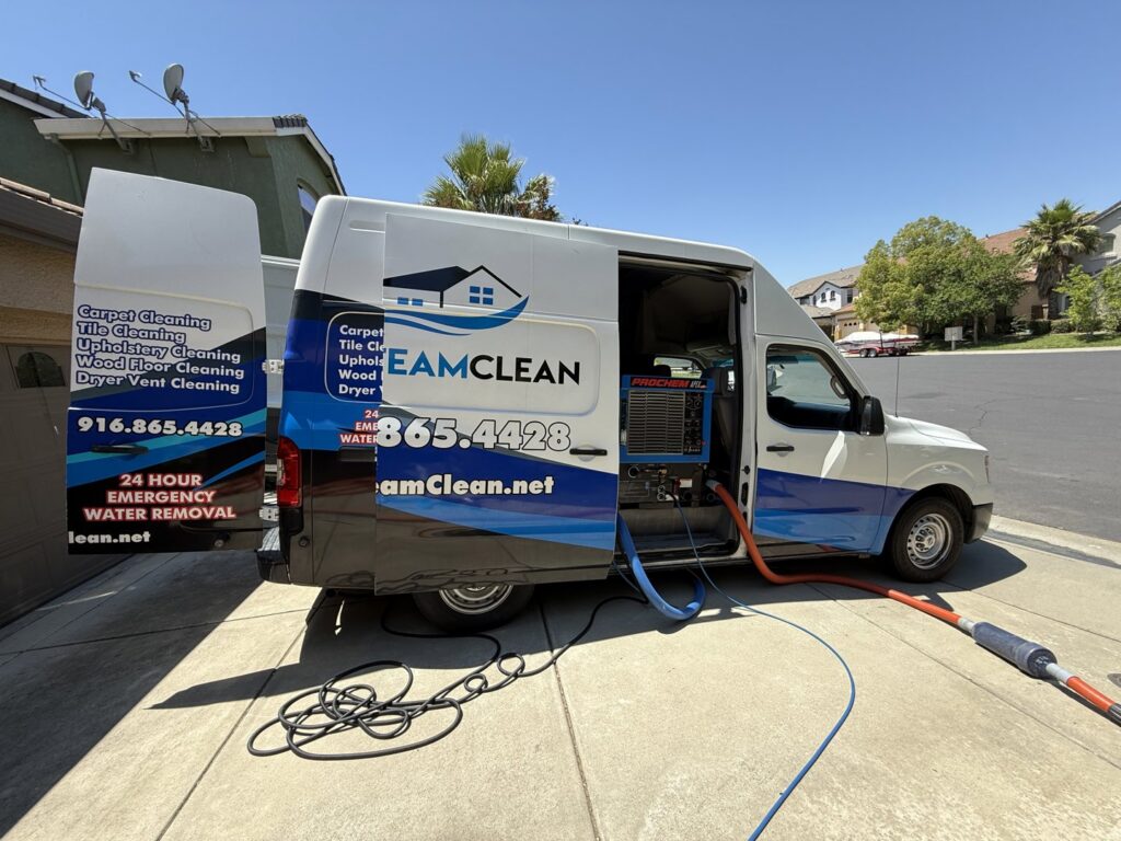 Pro Team Carpet Cleaning Sacramento, CA van parked with hoses extended for a residential carpet cleaning job.