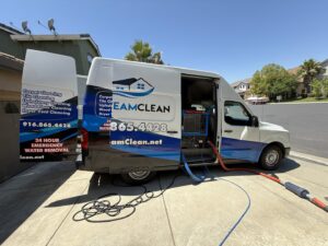 Pro Team Carpet Cleaning Sacramento, CA van parked with hoses extended for a residential carpet cleaning job.