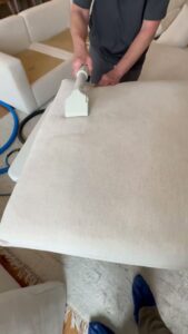 A close-up of a carpet cleaning wand in action on a light-colored carpet by Atlanta Top Force Carpet Cleaning in Roswell, GA.