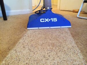A CX-15 carpet cleaning wand actively cleaning a carpet, showing a clear line by Dirt Blasters Carpet Cleaning Inc. in Atlanta, GA