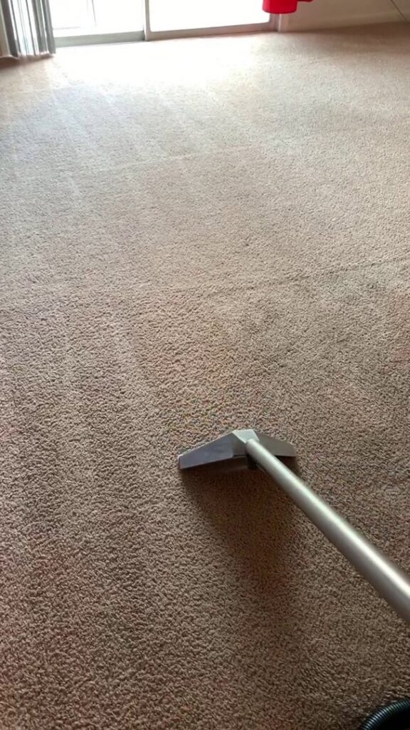 A carpet cleaning wand in action, deep cleaning a residential carpet by Iclean Indy in Indianapolis, IN.