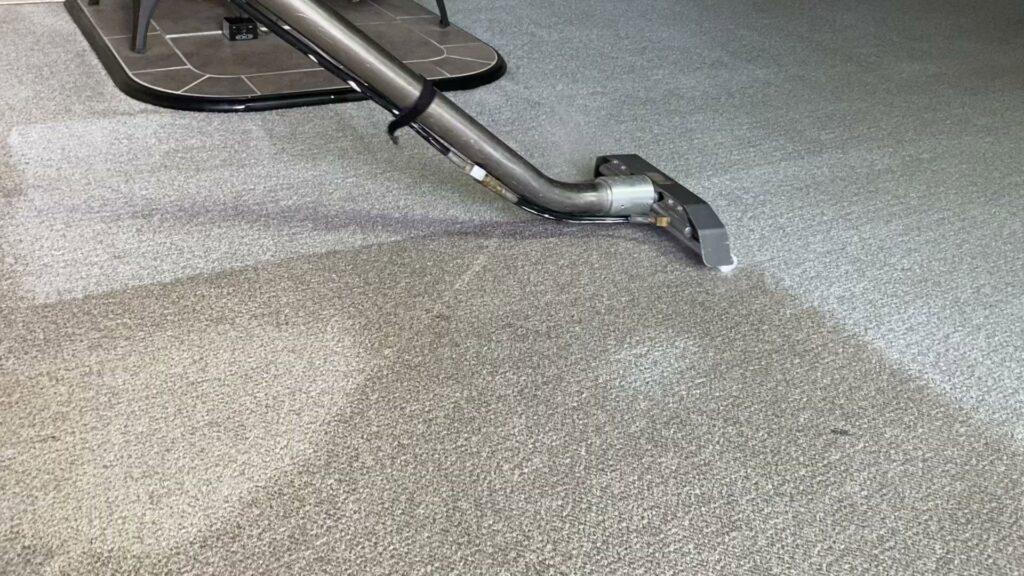 A carpet cleaning wand in action, showing a clean path on a light-colored carpet by Mountain View Carpet Care in Vancouver, WA
