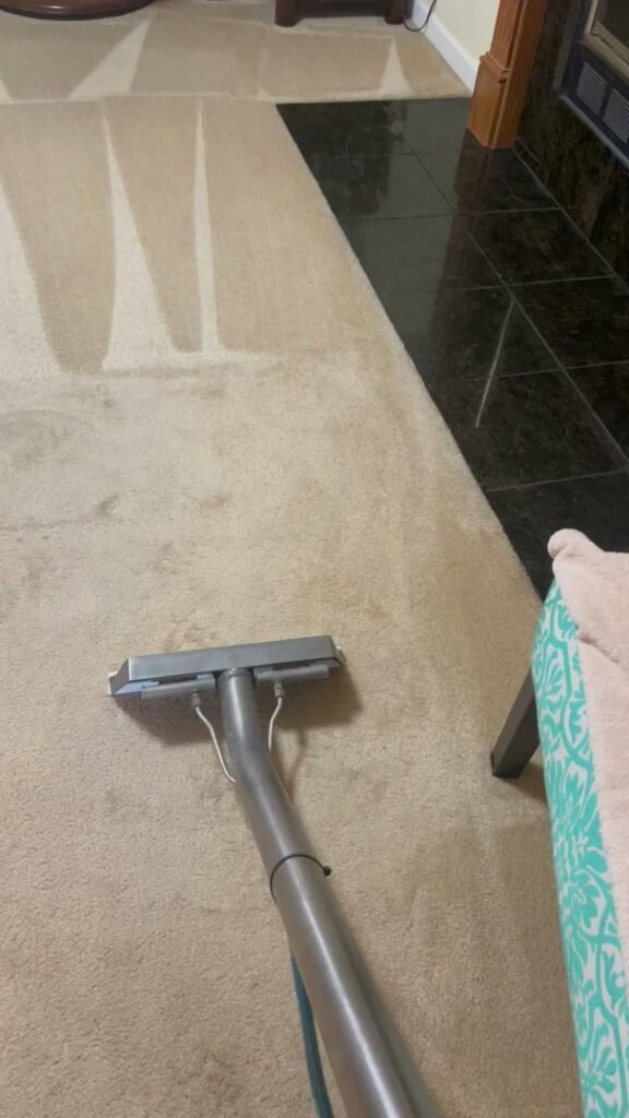 A carpet cleaning wand being used to clean a light-colored carpet by Jones Carpet Care LLC in Huntsville, AL.