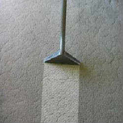 A carpet cleaning wand revealing a clean strip on a dirty carpet, highlighting the effectiveness of Steam Solutions Carpet Cleaning in San Antonio, TX.