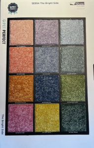 Close-up of carpet color swatches including Fuzzy Feeling and Silver Lining from Dalton Wholesale in Adairsville, GA.