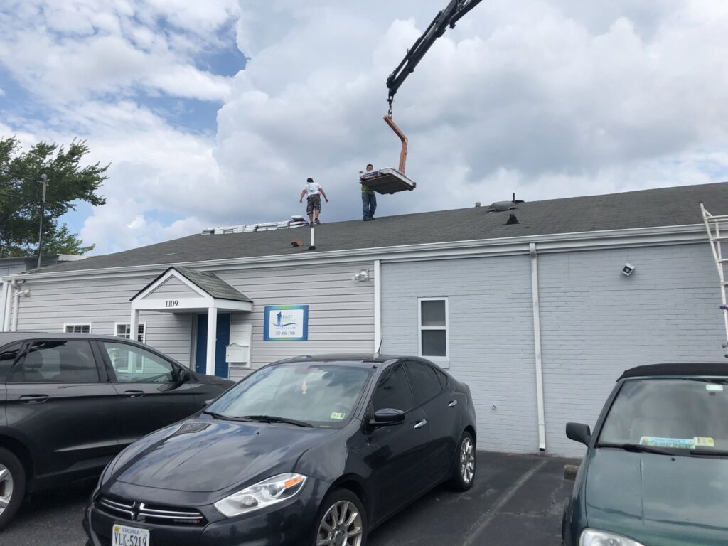 A black carpet drying fan in use after cleaning or water extraction by East Coast Carpet Care, Inc. in Chesapeake, VA.