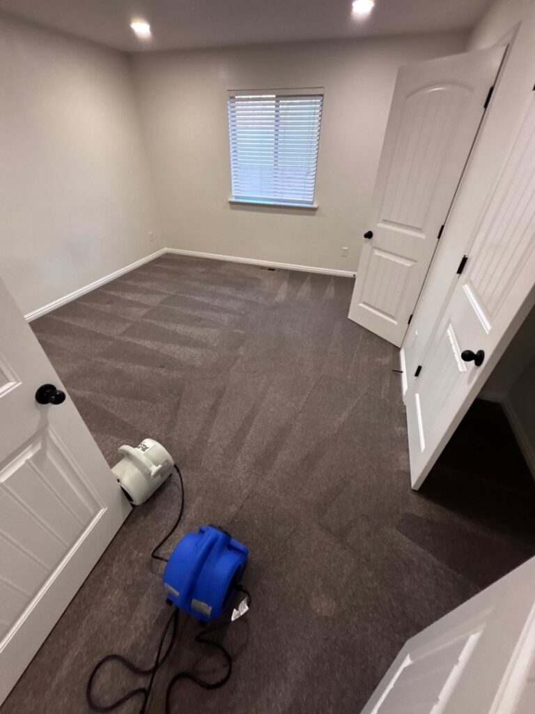 Two carpet drying fans in a bedroom after professional carpet cleaning by Rio Clean Solution in Salt Lake City, UT.
