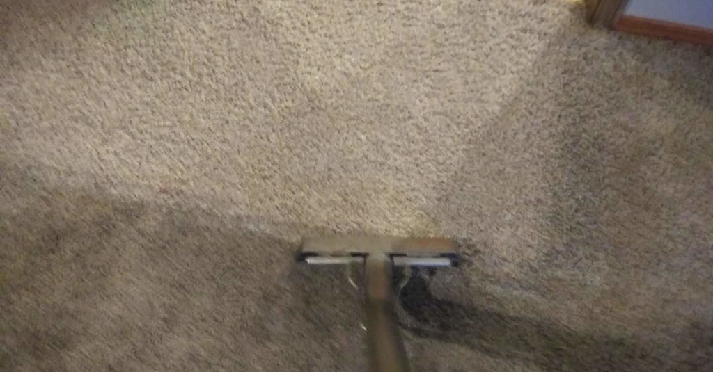 Close-up of carpet extraction cleaning equipment working on a dirty carpet by C&S Carpet Cleaning in Cyril, OK.