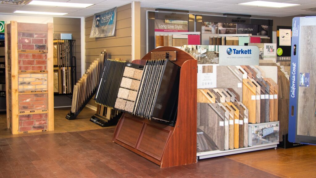 A wide selection of carpet and flooring samples displayed in the showroom of InVision Construction in Pearl, MS.