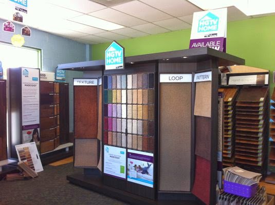 A wide selection of carpet and flooring samples displayed in the showroom at LACarpetWarehouse in Los Angeles, CA.