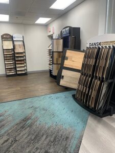 A showroom displaying various carpet and flooring samples at Pg Long Floorcovering LLC in Portland, OR.