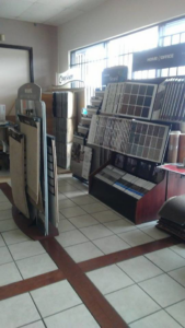 A showroom display of various carpet and flooring samples at The Carpet Plaza in Bakersfield, CA