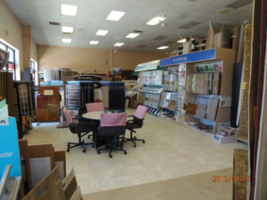 Interior view of the carpet and flooring showroom at Carpets by EJ - Alemar in Wilmington, DE, displaying various samples.