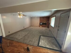 Carpet installation in progress in a living room by Carpet Depot Okc in Oklahoma City, OK.