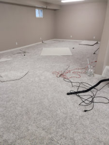 Carpet installation in progress in a room by Rendon Flooring in Green River, WY.