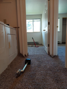 Carpet installation in progress with tools in a hallway by Columbia Flooring Group in Troutdale, OR
