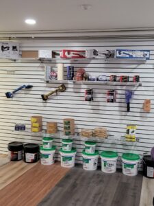 A display of carpet installation tools and supplies at Central Floors Wholesaler in Rockville, MD
