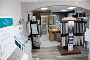 A section of the Carpet King Interiors / Abbey Carpet & Floor showroom in Fernley, NV, featuring numerous carpet samples.