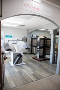 An interior view of the Carpet King Interiors / Abbey Carpet & Floor showroom, showcasing various flooring and carpet displays in Fernley, NV.
